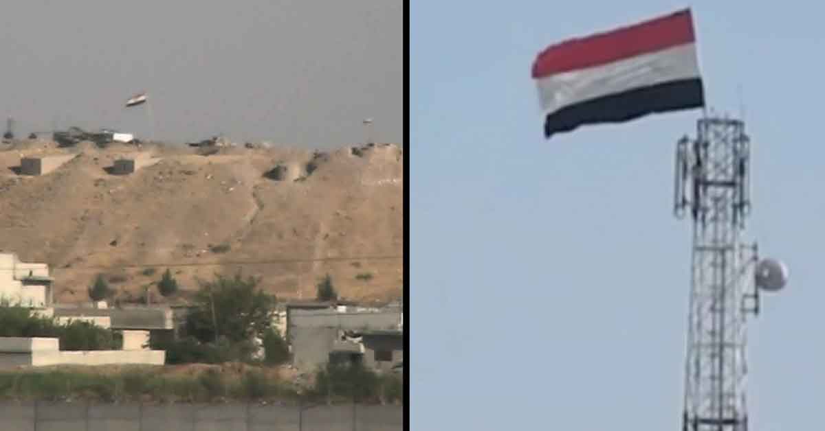 Urfa sınırında YPG’li teröristler rejim bayrağı çekti